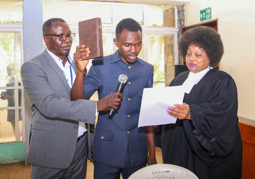 The incoming SATUK Chairperson Mr. Odhiambo Moses Okal take oath of office during the swearing-in ceremony