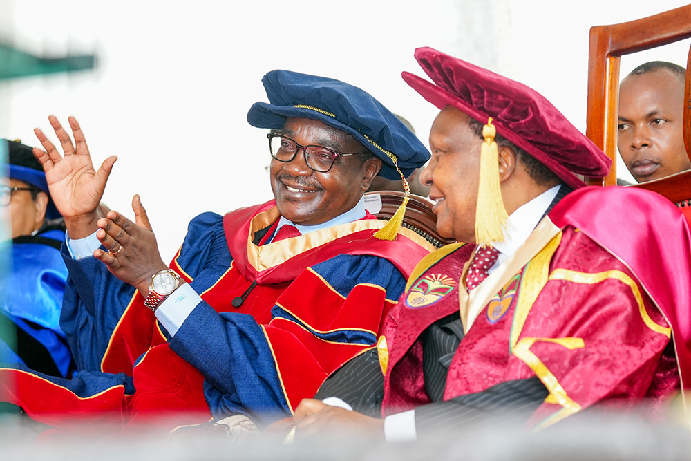 Education CS, Mr Julius Ogamba confers with the Chancellor, Hon.Dr Jared Kangwana during the 14th graduation ceremony