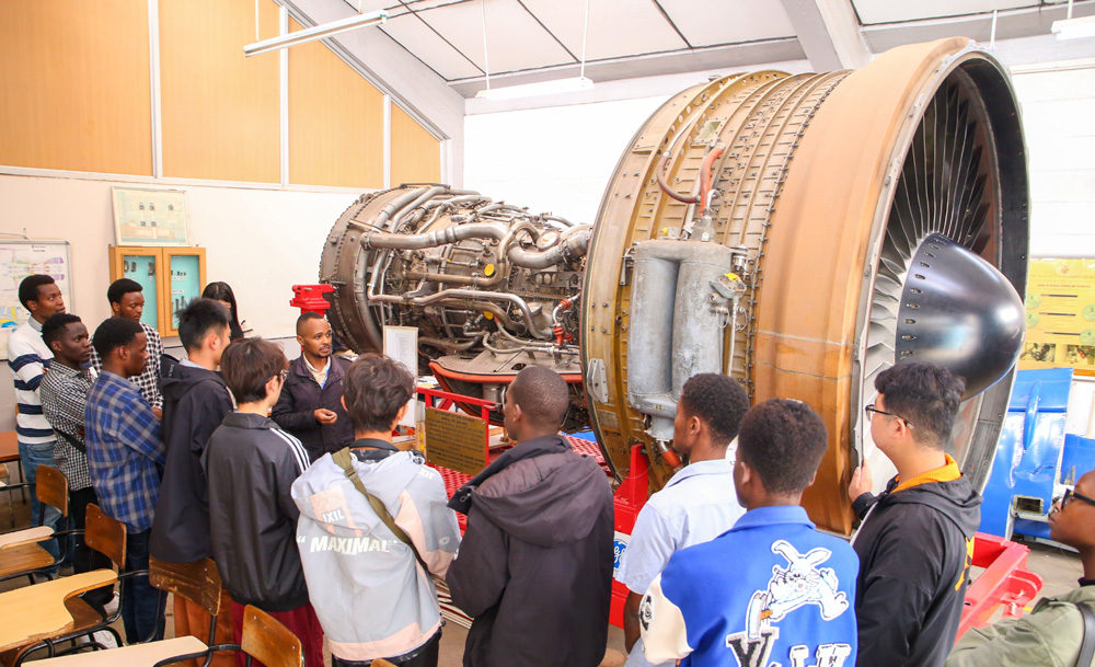 Students from Weixian College, China with their TU-K counterparts tour the Aeronautical Engineering Workshop at the University.