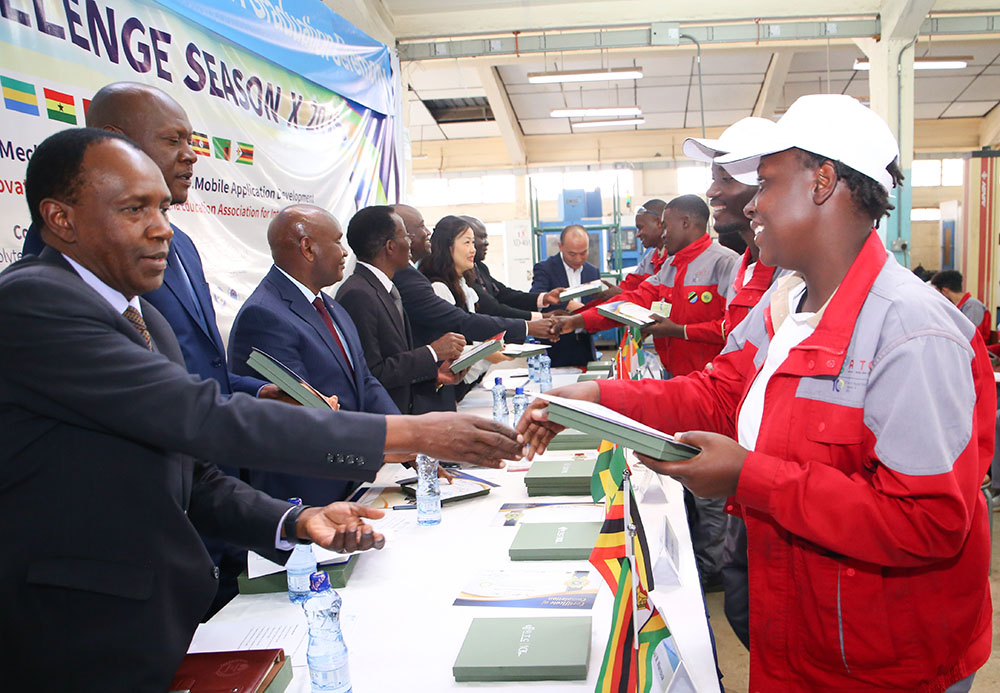 Graduates from the Africa Tech Challenge Season 10 receive certificates during the ceremony