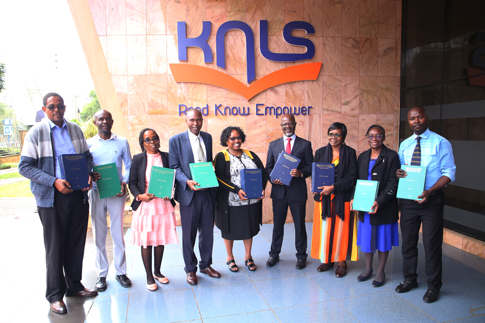 SGAS Director, Prof. Tom Kwanya together with KNLS Acting Director, Ms. Betty Kalugho lead members of staff from the two institutions during the theses and dissertations handover ceremony 