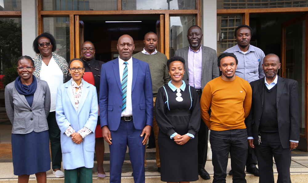 Prof. Alfred Orina, DVC, Research and Technology Development together with Prof. George Amolo, Ag. Executive Dean FAST & a team from the Department of Physics, Earth and Environmental Sciences in a group picture with a delegation from ActionLab that was led by Pauline Kanana
