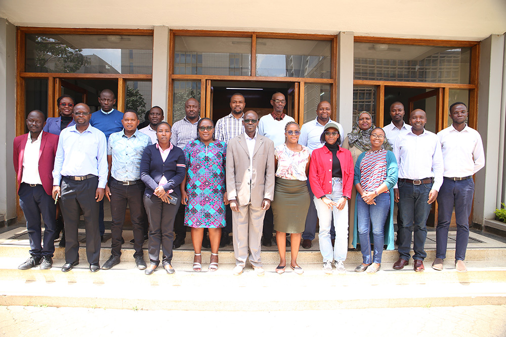 Guest attendees and trainers accompanied by staff members from TU-K pose for a group photo.