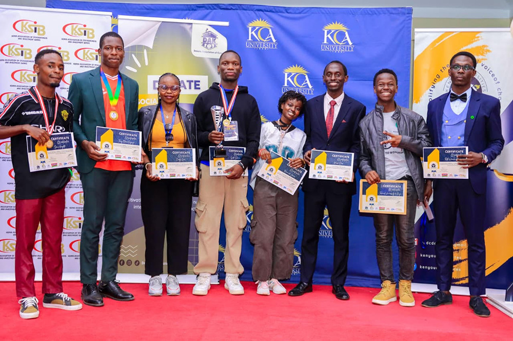 TU-K team together with their patrons when they were awarded a trophy and certificates