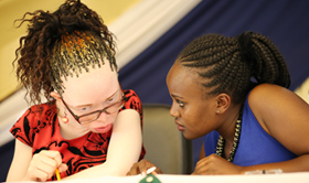 TU-K Special Needs Secretary Esther Mukami (Right) chatting-with one of the speakers from Egerton University during TU-K Disability Awareness Day