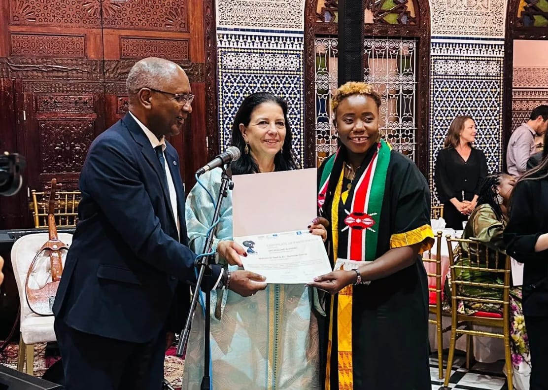 Dr. Jacqueline Okeyo (Right) receives a certificate of the grant award in Morocco.