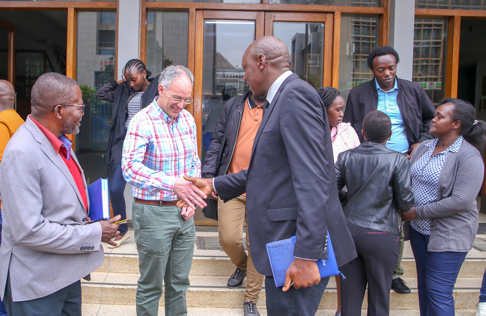 DVC, RTD Prof. Isaac Orina with Erasmus+ lead shake hands with Prof. Javier Junquera from the University of Cantabria, Spain. School of Physics and Earth Sciences under the leadership of Prof. George Amolo hosted the visiting professor to a one-day workshop.